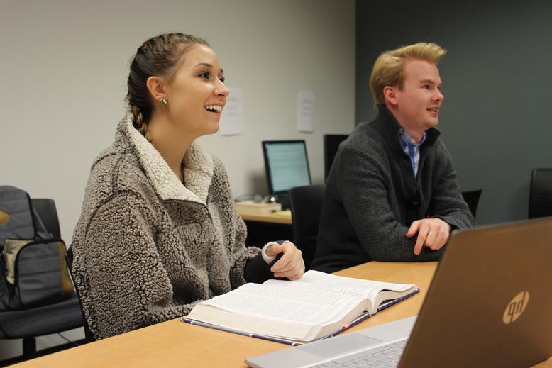 Two students in the College of Business Tutoring Lab