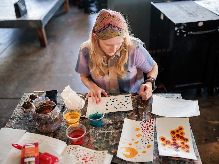 MSU Denver student, Tatum Newman, works on a project in Painting and New Contexts class on May 3, 2023. Photo by Alyson McClaran